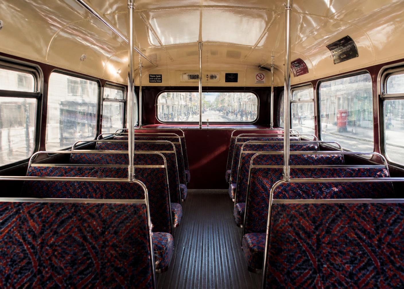 Upper deck interior of the Routemaster with moquette seats and chrome rails